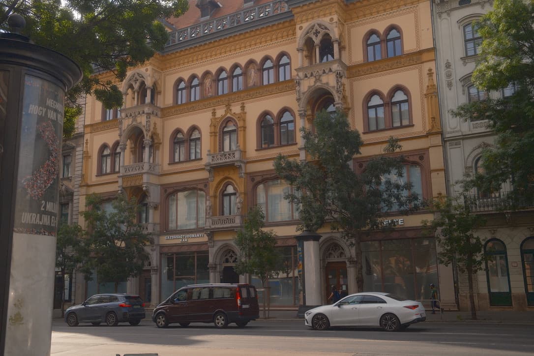 Friends laughing together in a hidden courtyard cafe